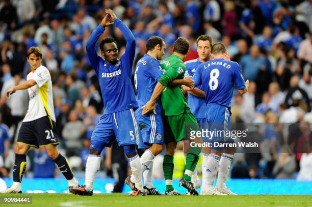 Carlo Cudicini the Tottenham goalkeeper is hugged by former Chelsea teammates following the final whistle during the Barclays Premier League match...