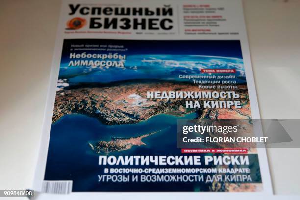 Picture taken on January 10 shows a front page of a Russian bussiness magazine at the offices of Vestnik Kipra in the Cypriot port city of Limassol....