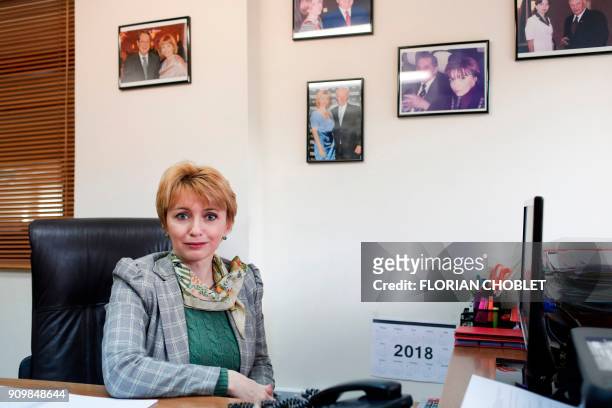 Natalia Kardash, an editor at Vestnik Kipra a bi-monthly Russian newspaper, poses at her office in the Cypriot port city of Limassol on January 10,...