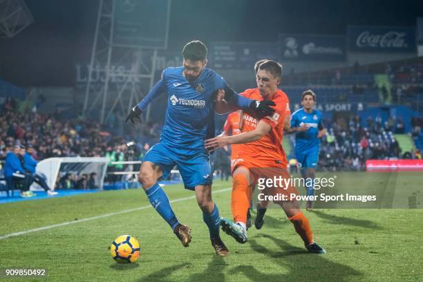 Jorge Molina Vidal of Getafe CF fights for the ball with Federico Ricca Rostagnol of Malaga CF during the La Liga 2017-18 match between Getafe CF and...
