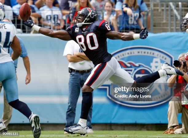 Andre Johnson of the Houston Texans catches a touchdown pass against the Tennessee Titans during the NFL game at LP Field on September 20, 2009 in...