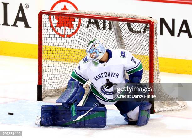 Goaltender Anders Nilsson of the Vancouver Canucks takes part in the pre-game warm up prior to NHL action against the Winnipeg Jets at the Bell MTS...