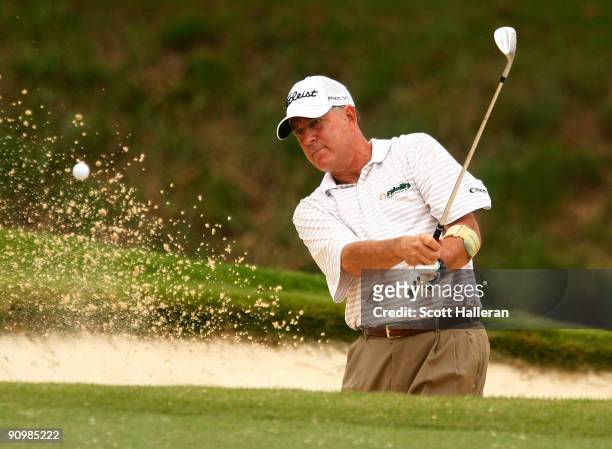 Jay Haas plays a bunker shot on the ninth hole during the final round of the Greater Hickory Classic at the Rock Barn Golf & Spa on September 20,...