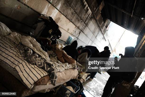 Heroin users gather under a bridge where many of them live with other addicts in the Kensington section which has become a hub for heroin use on...
