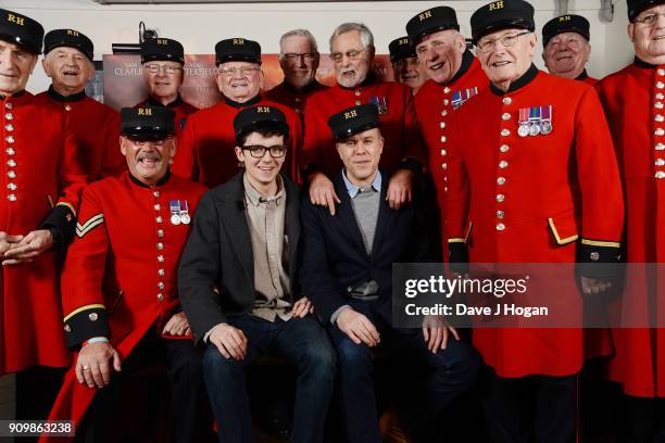 Asa Butterfield and Director Saul Dibb poses with Chelsea Pensioners at the screening and Q&A of "Journey's End" at Picturehouse Central on January...