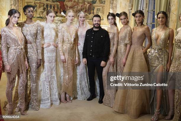 Models pose backstage with designer Zuhair Murad prior the Zuhair Murad Spring Summer 2018 show as part of Paris Fashion Week on January 24, 2018 in...