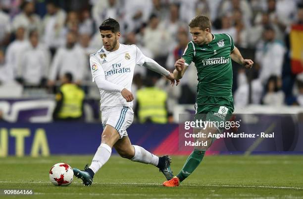 Marcos Llorente of Real Madrid competes for the ball with Darko Brasanac of Leganes during the Spanish Copa del Rey, Quarter Final, Second Leg match...