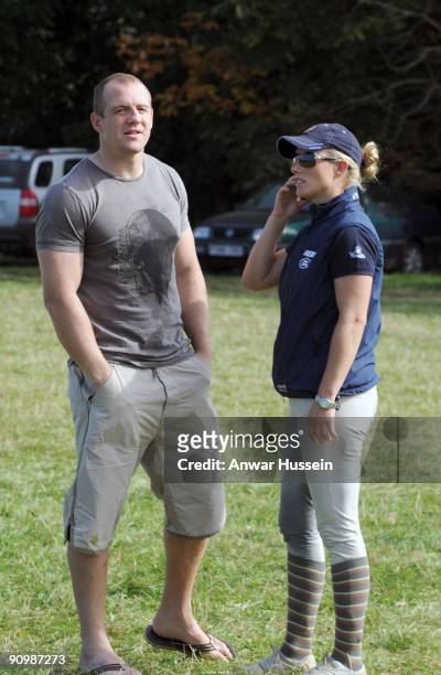 Zara Phillips chats on her mobile phone as she and Mike Tindall attend the Gatcombe Horse Trials Three Day Event on September 20, 2009 in...