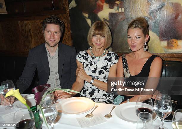 Christopher Bailey, Anna Wintour and Kate Moss attend the Unique private dinner, at the IVY on September 20, 2009 in London, England.