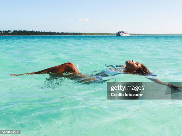 clearing my minds - african woman swimming stock pictures, royalty-free photos & images