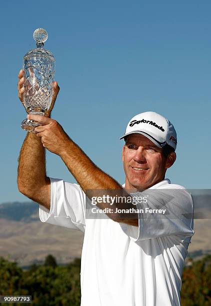 Fran Quinn hoists the trophy after winning the final round of the Albertson's Boise Open at Hillcrest Country Club on September 20, 2009 in Boise,...