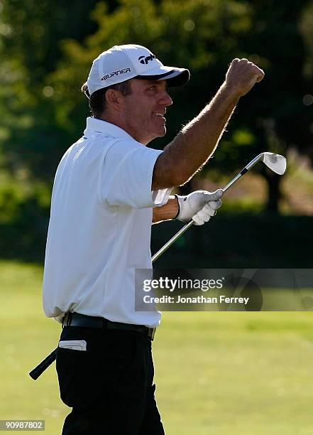 Fran Quinn pumps his fist after hitting his second shot on the 18th hole to four feet setting up a winning birdie putt during the final round of the...