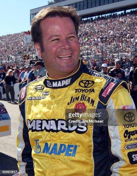 Robby Gordon, driver of the Sylvania Toyota, looks on from the grid prior to the start of the NASCAR Sprint Cup Series Sylvania 300 at the New...