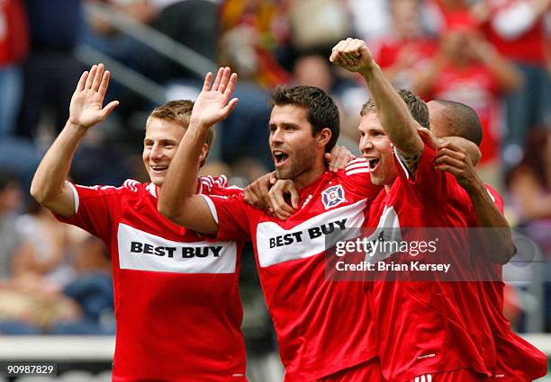 Chris Rolfe, Peter Lowry and Logan Pause of the Chicago Fire celebrate Lowry's goal during the first half against the Columbus Crew at Toyota Park on...