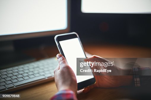 Male Hands Using Phone With Two Pcs Working In Background High-Res ...