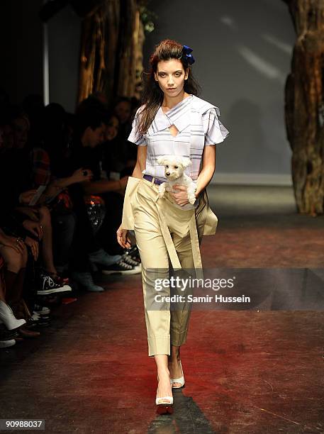 Daisy Lowe walks the catwalk with her dog during the Vivienne Westwood Red Label Fashion Show during London Fashion week at the Red Bull Fashion...