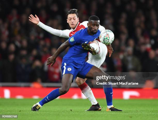 Mesut Ozil of Arsenal takes on Antonio Rudiger of Chelsea during the Carabao Cup Semi-Final Second Leg between Arsenal and Chelsea at Emirates...