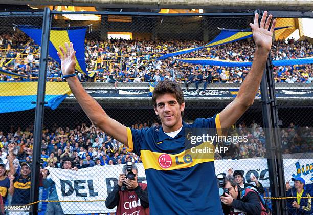 Argentina's tennis player Juan Martin Del Potro, the 2009 US Open Tennis champion, wears a Boca Juniors' jersey as he waves before an Argentina first...