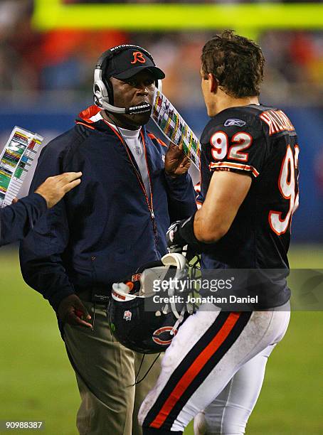 Head coach Lovie Smith of the Chicago Bears gives instructions to Hunter Hillenmeyer during a game against the Pittsburgh Steelers on September 20,...