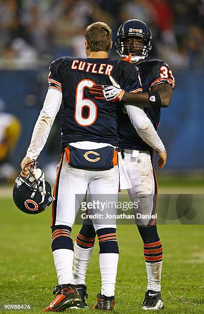 Charles Tillman of the Chicago Bears hugs teammate Jay Cutler after a win over the Pittsburgh Steelers on September 20, 2009 at Soldier Field in...