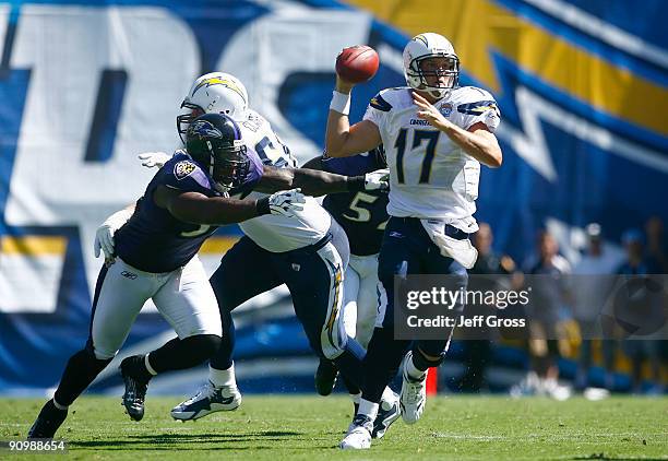 Quarterback Philip Rivers of the San Diego Chargers is pressured by Terrell Suggs of the Baltimore Ravens in the first half at Qualcomm Stadium on...