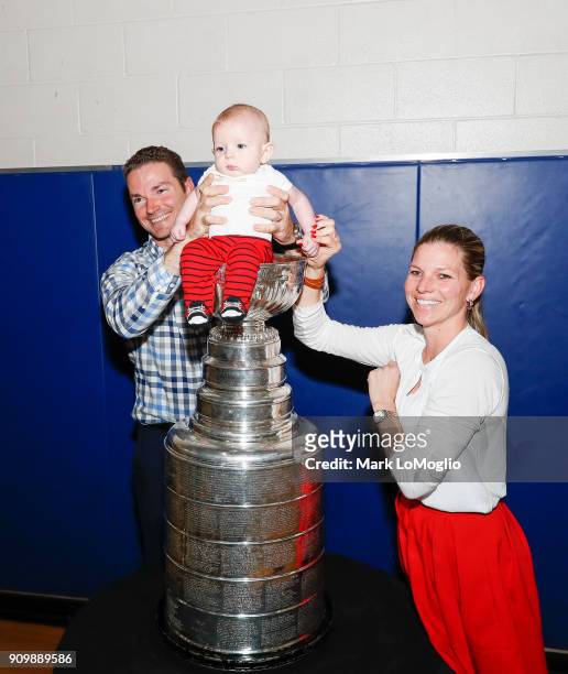 A family poses with their baby in the Stanley Cup during its visit to  News Photo - Getty Images