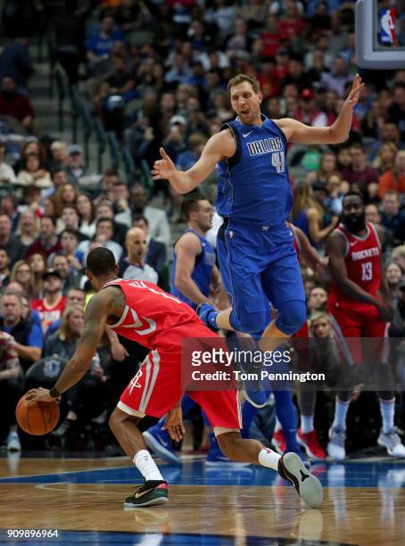 Dirk Nowitzki of the Dallas Mavericks covers Trevor Ariza of the Houston Rockets in the first half at American Airlines Center on January 24, 2018 in...