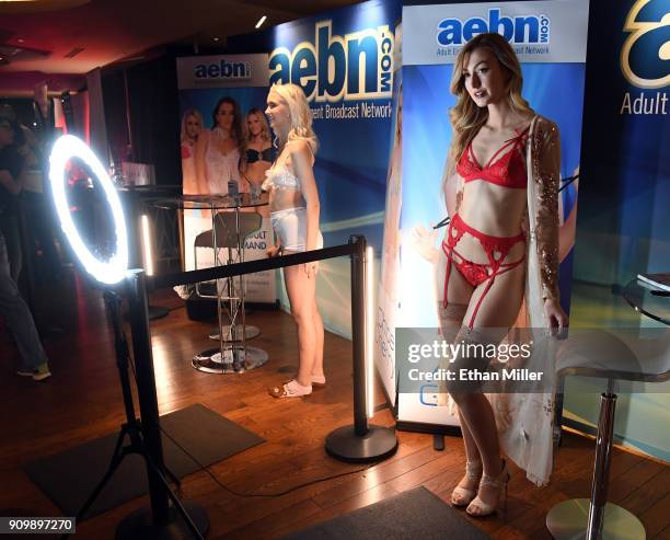 Adult film actresses Chloe Cherry and Alexa Grace pose for photos at the Adult Entertainment Broadcast Network booth at the 2018 AVN Adult...