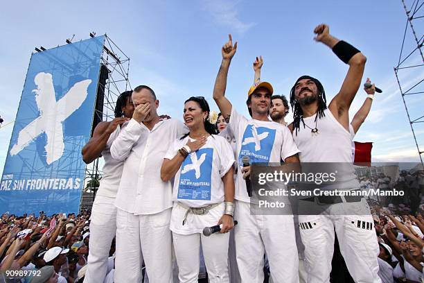 Artists Miguel Bose of Spain and Olga Tanon of Puerto Rico break out in tears as they sing together with Juanes of Colombia and X-Alfonso of Cuba and...