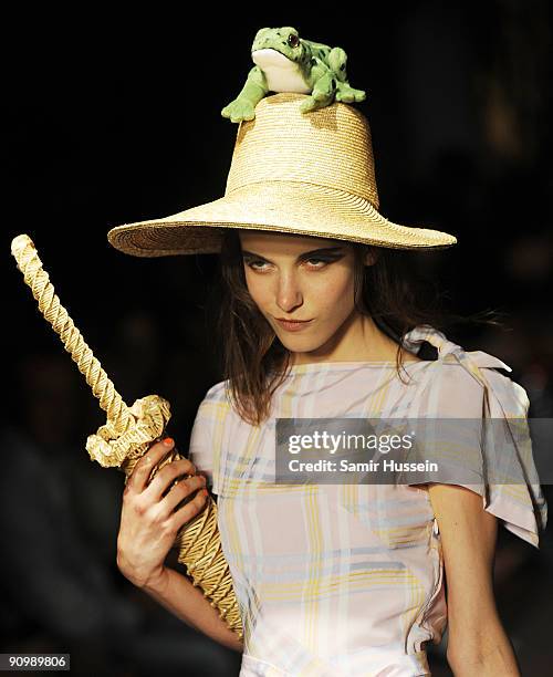 Model walks the catwalk during the Vivienne Westwood Red Label Fashion Show during London Fashion week at the Red Bull Fashion Factory on September...