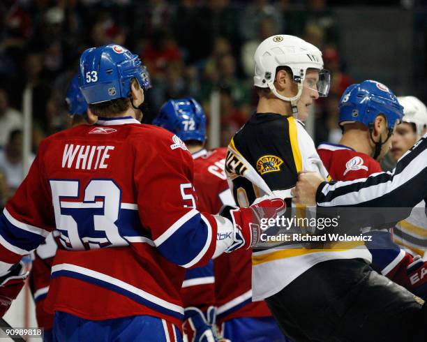 Ryan White of the Montreal Canadiens hold Mikko Lehtonen of the Boston Bruins during their NHL Preseason game on September 20, 2009 at the Colisee...