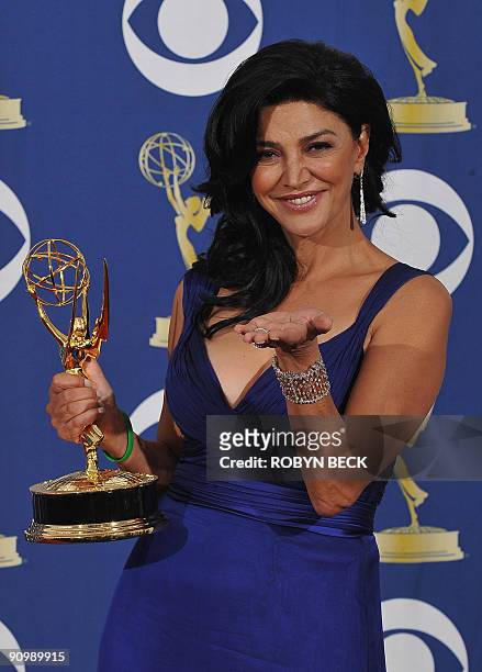Actress Shohreh Aghdashloo from the TV show "House Of Saddam" holds the Best Supporting Actress in a Miniseries or Movie award, in the press room...
