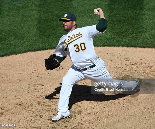 Dana Eveland of the Oakland Athletics pitches against the Cleveland Indians during the game at the Oakland-Alameda County Coliseum on September 20,...