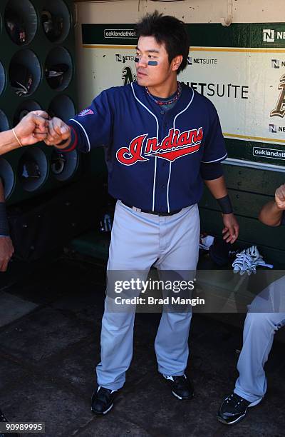 Shin-Soo Choo of the Cleveland Indians gets ready in the dugout before the game against the Oakland Athletics at the Oakland-Alameda County Coliseum...