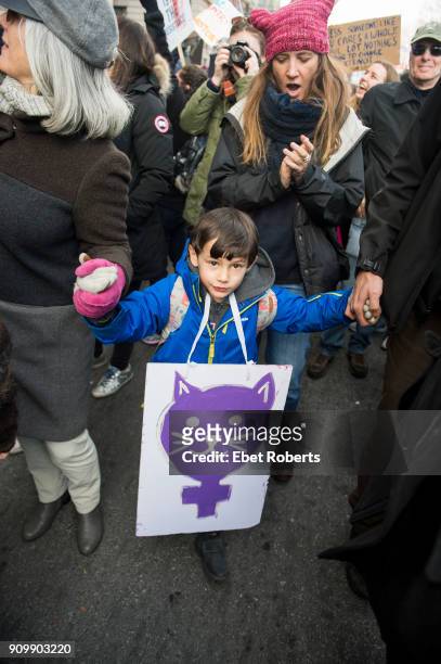 Boy with a placard among the demonstrators at the 2018 Women's March in New York City on January 20, 2018.