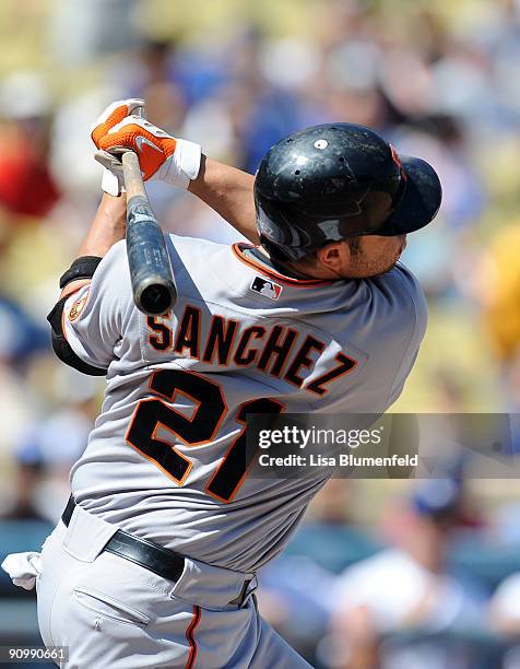 Freddy Sanchez of the San Francisco Giants hits a single in the first inning against the Los Angeles Dodgers at Dodger Stadium on September 20, 2009...