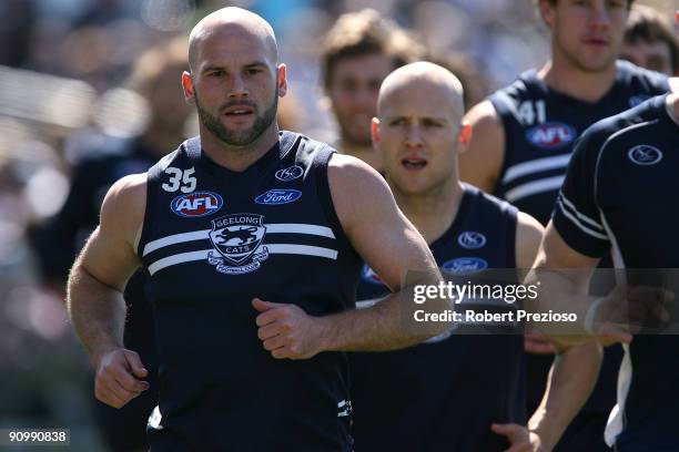 Paul Chapman of the Cats runs with team-mates during a Geelong Cats AFL training session at Skilled Stadium September 21, 2009 in Melbourne,...