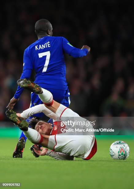 Golo Kante of Chelsea in action with Mesut Ozil of Arsenal during the Carabao Cup Semi-Final 2nd leg match between Arsenal and Chelsea at Emirates...