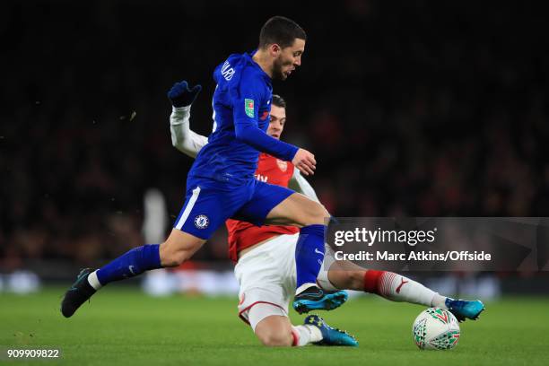 Eden Hazard of Chelsea tackled by Granit Xhaka of Arsenal during the Carabao Cup Semi-Final 2nd leg match between Arsenal and Chelsea at Emirates...