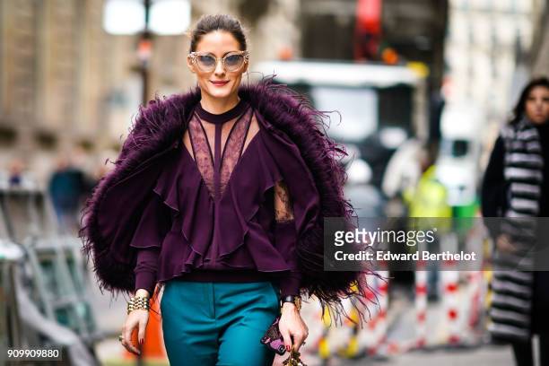 Olivia Palermo wears a purple fur coat, blue pants, sunglasses, outside Elie Saab, during Paris Fashion Week - Haute Couture Spring/Summer 2018, on...