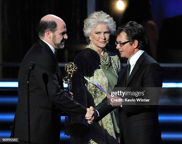 Writer Matthew Weiner accepts the Outstanding Writing for a Comedy Series award for "Madmen" from actress Ellen Burstyn and actor Michael J. Fox...