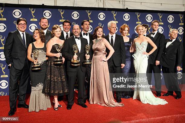 The cast and crew of "Mad Men" pose with their Emmy for Oustanding Drama Series in the press room at the 61st Primetime Emmy Awards held at the Nokia...