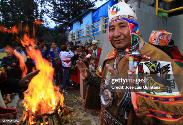 An Aymara priest, "Yatiris" makes an offering to the god Ekeko on the eve of the Alasitas festival on January 23, 2018 in La Paz, Bolivia. Alasitas...