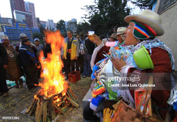 Man dressed as a Ekeko raise a glass of beer to bless the participants during the Alasitas festival on January 23, 2018 in La Paz, Bolivia. Alasitas...