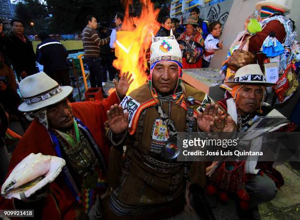 An Aymara priest, "Yatiris" makes an offering to the god Ekeko on the eve of the Alasitas festival on January 23, 2018 in La Paz, Bolivia. Alasitas...