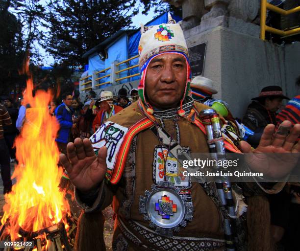 An Aymara priest, "Yatiris" makes an offering to the god Ekeko on the eve of the Alasitas festival on January 23, 2018 in La Paz, Bolivia. Alasitas...