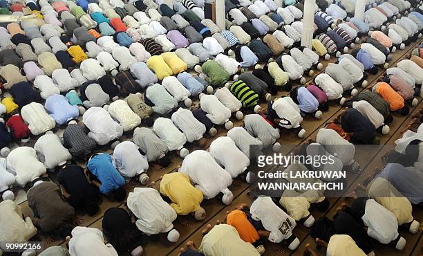 Sri Lankan Muslims offer a special prayer during on the occasion of the Eid al-Fitr in Colombo on September 21, 2009. Home to more than 19 million...