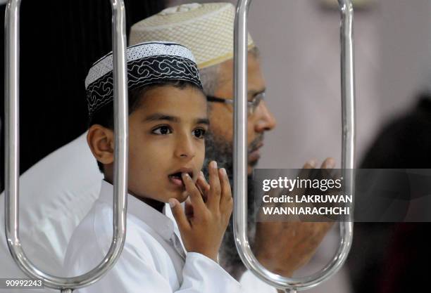 Sri Lankan Muslim boy attends a special prayer celebrating Eid al-Fitr in Colombo on September 21, 2009. Home to more than 19 million people, Muslims...