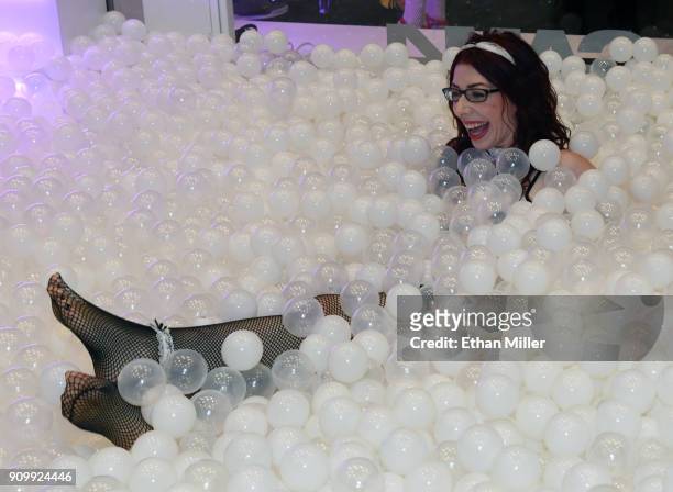 Webcam model Sammy Strips plays in a ball pit at the CAM4 booth at the 2018 AVN Adult Entertainment Expo at the Hard Rock Hotel & Casino on January...