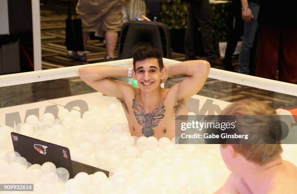 Webcam model Christian F plays in a ball pit at the CAM4 booth during the 2018 AVN Adult Expo at the Hard Rock Hotel & Casino on January 24, 2018 in...